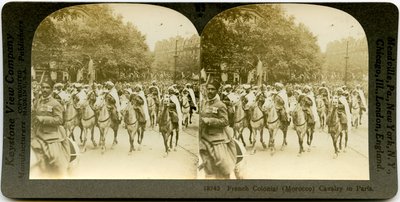 Horizontal, sepia, stereocard showing uniformed men on horseback marching in a parade. Keystone Stereograph number 18743. The title reads by Keystone View Company